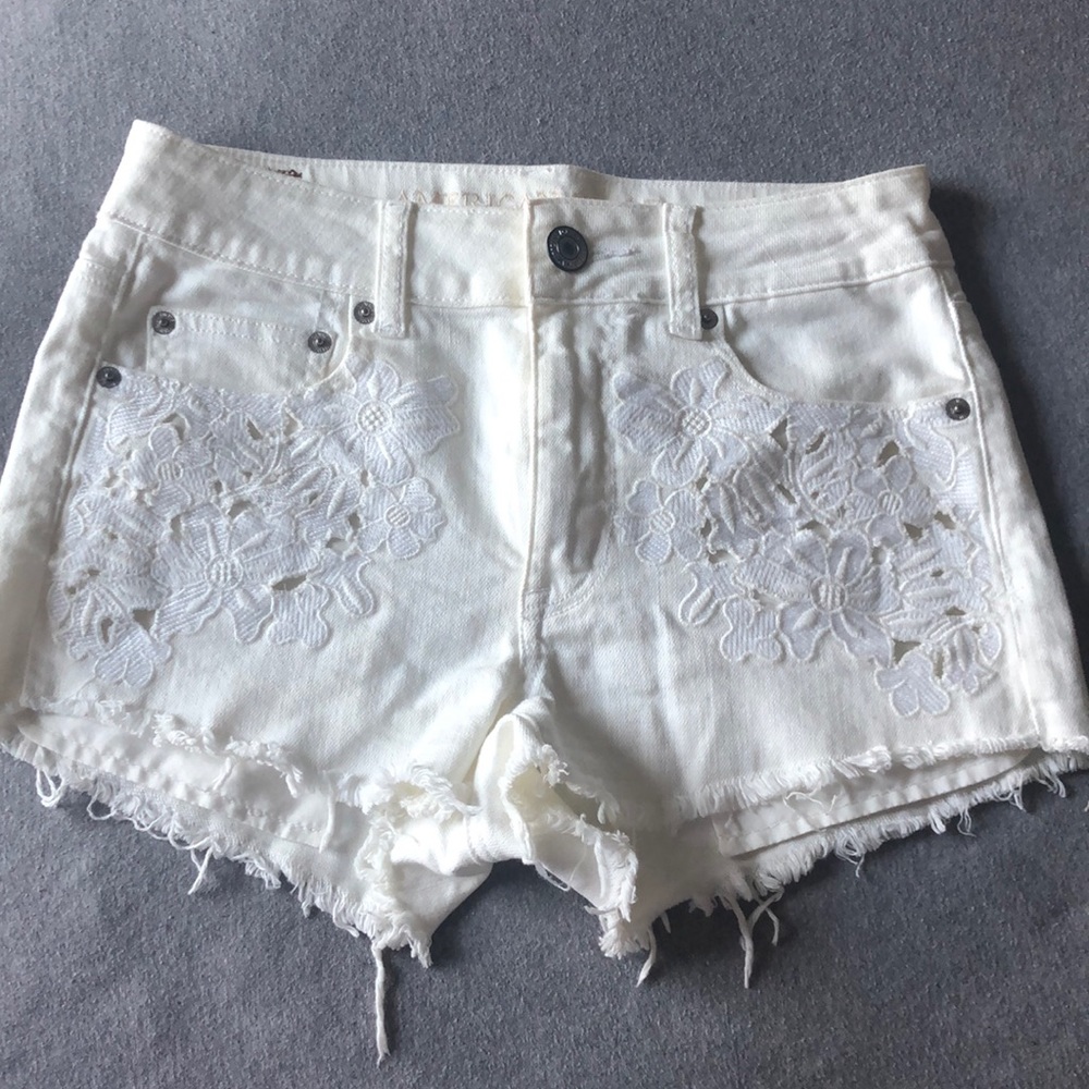 American Eagle white shorts with floral embroidery